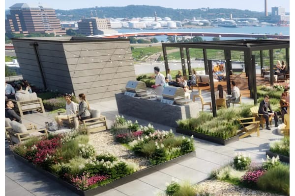 A group of people are sitting on a rooftop terrace at Twenty Fair Apartments, New Haven, CT, 06511